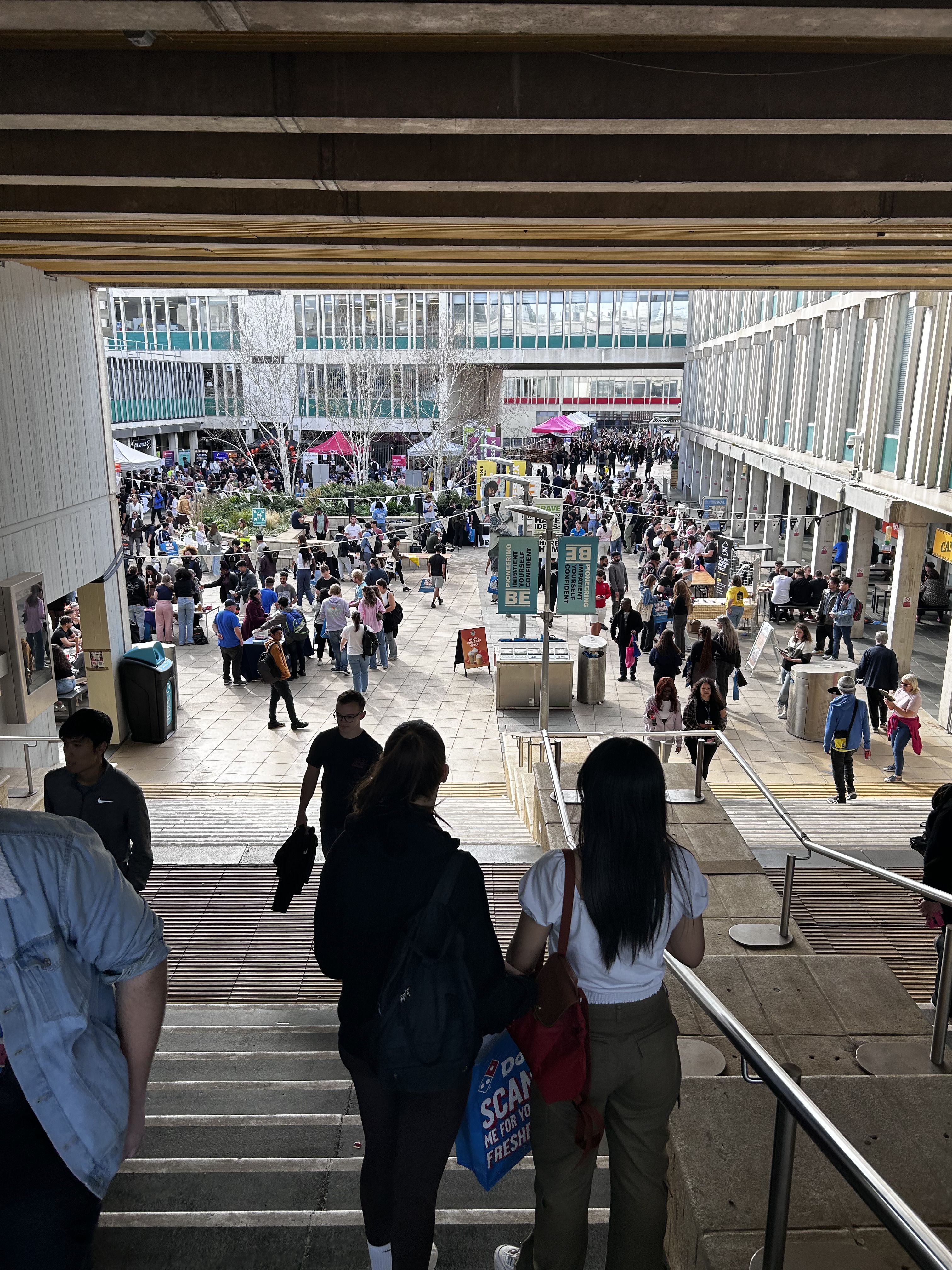 View from square 4 into square 3. Students are walking down the steps with more students visible in the lower square